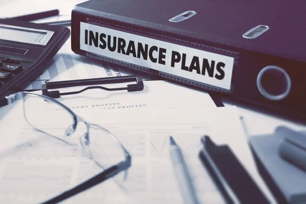 A binder reading "flood insurance"